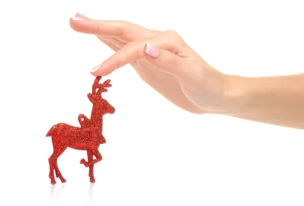 Juguete de Navidad ciervo rojo en la mano — Foto de Stock
