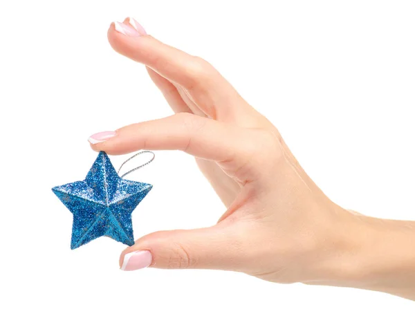 Juguete de Navidad estrella azul en la mano —  Fotos de Stock