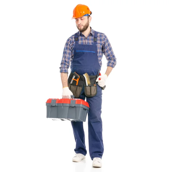 Hombre joven constructor con caja de herramientas trabajador de la industria hardhat va a ir —  Fotos de Stock