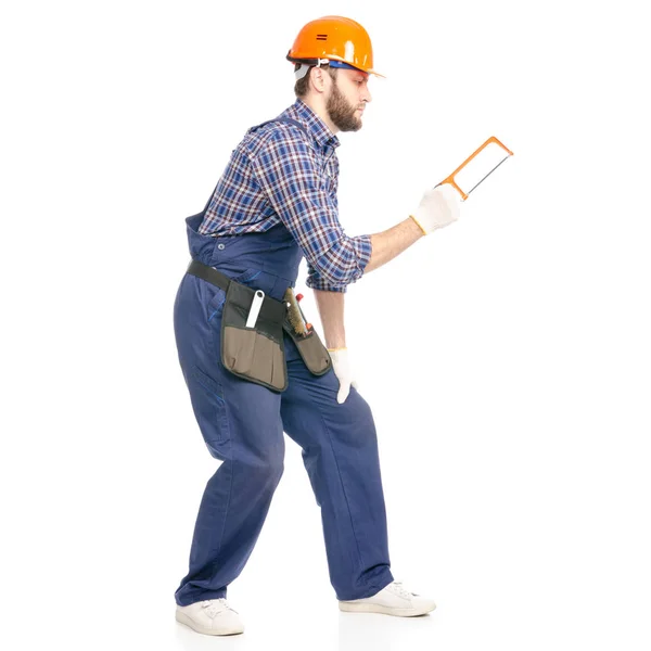 Constructor de hombre joven con cinturón de herramientas sierra sierra trabajador de la industria hardhat —  Fotos de Stock