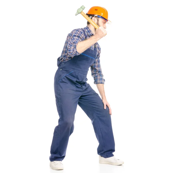 Hombre joven constructor industria trabajador hardhat con un martillo —  Fotos de Stock