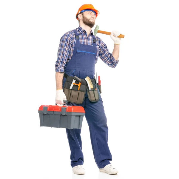 Jovem construtor trabalhador da indústria com uma caixa de ferramentas de martelo — Fotografia de Stock