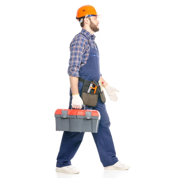 Junger Mann Bauarbeiter mit Werkzeugkiste Industriearbeiter Hardhat kommt in Gang — Stockfoto