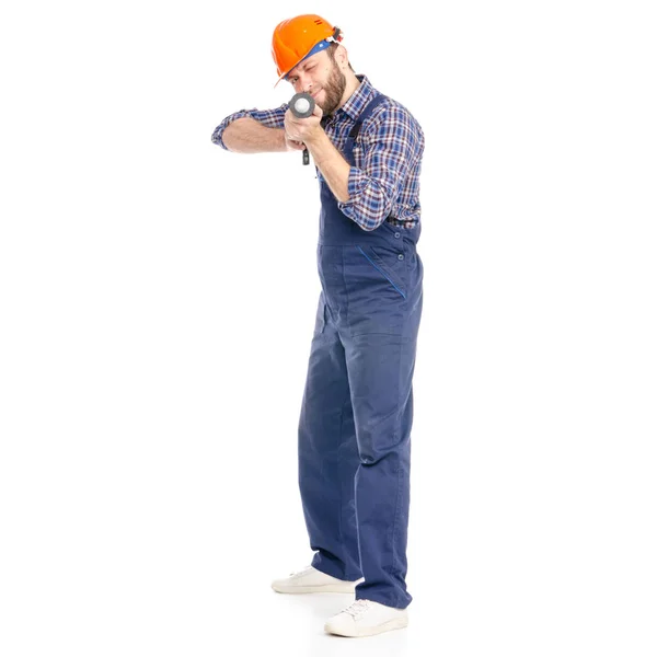 Jeune homme constructeur industrie travailleur hardhat avec un pistolet en silicone — Photo