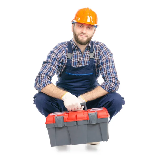 Молодий чоловік будівельник з інструментами промисловості працівник хардхаусом — стокове фото