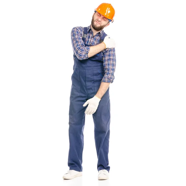 Молодой человек строитель промышленности трудящийся в твердой шляпе боль рука — стоковое фото