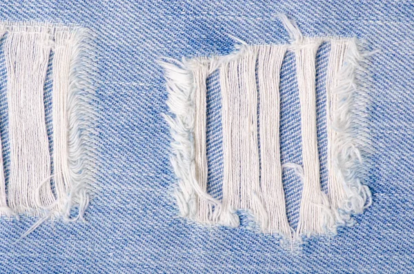 Jeans moda ragged thread textura tecido macro — Fotografia de Stock