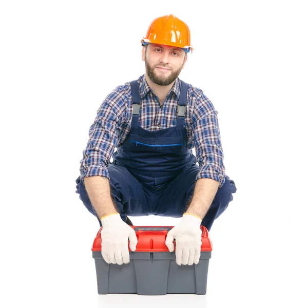 A fiatalember toolbox ipari munkás hardhat-készítő — Stock Fotó