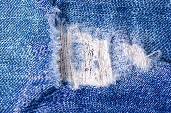 Jeans moda ragged thread textura tecido macro — Fotografia de Stock