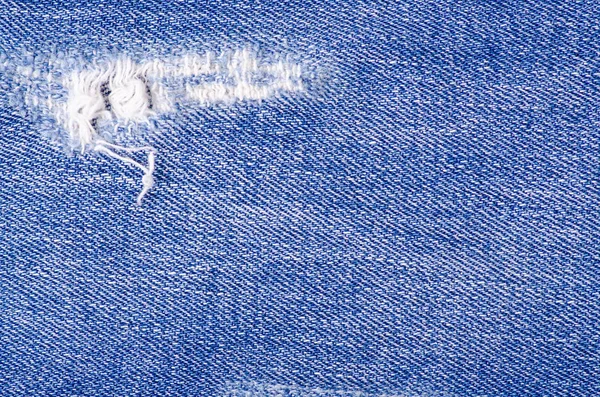 Jeans moda ragged thread textura tecido macro — Fotografia de Stock