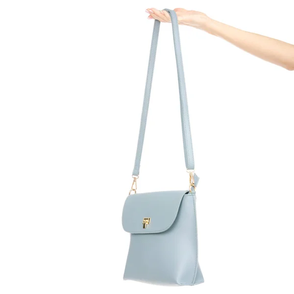 Saco de couro azul feminino na mão puxa para fora do saco — Fotografia de Stock