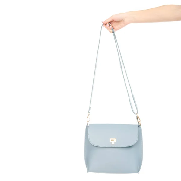 Saco de couro azul feminino na mão puxa para fora do saco — Fotografia de Stock