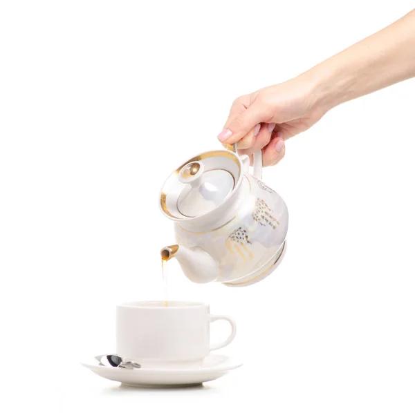 Teekanne Teekanne in der Hand Tasse und Untertasse — Stockfoto