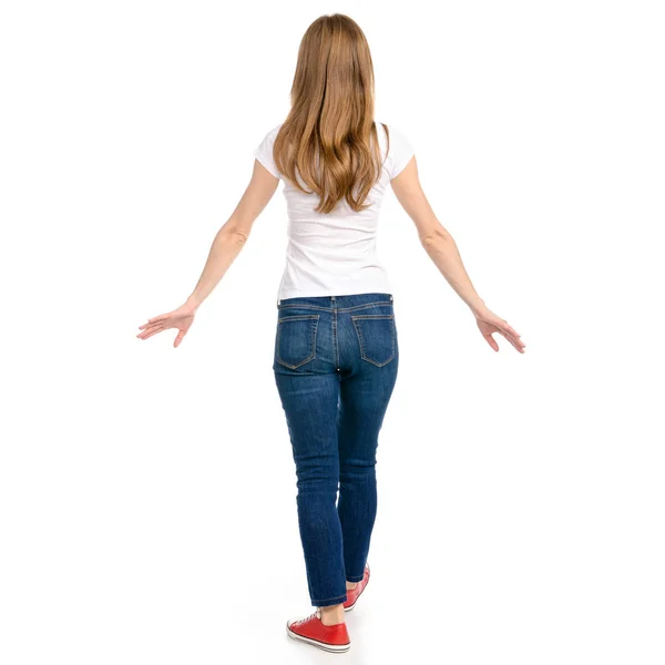 Woman in jeans and t-shirt runs goes — Stock Photo, Image