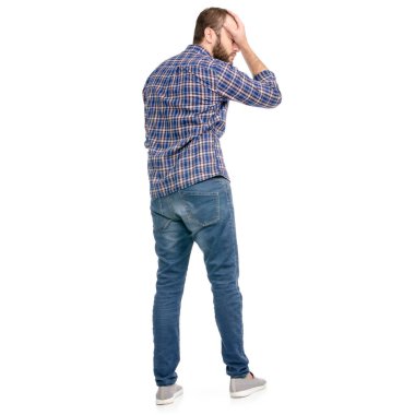 Bir adam bir beyaz arka plan yalıtım arkadan görünüm başını tutan kot pantolon