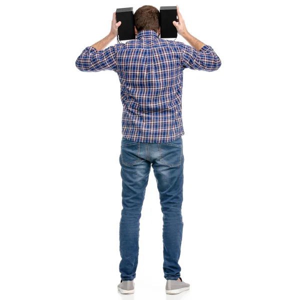 The man in jeans in the hands audio speakers — Stock Photo, Image