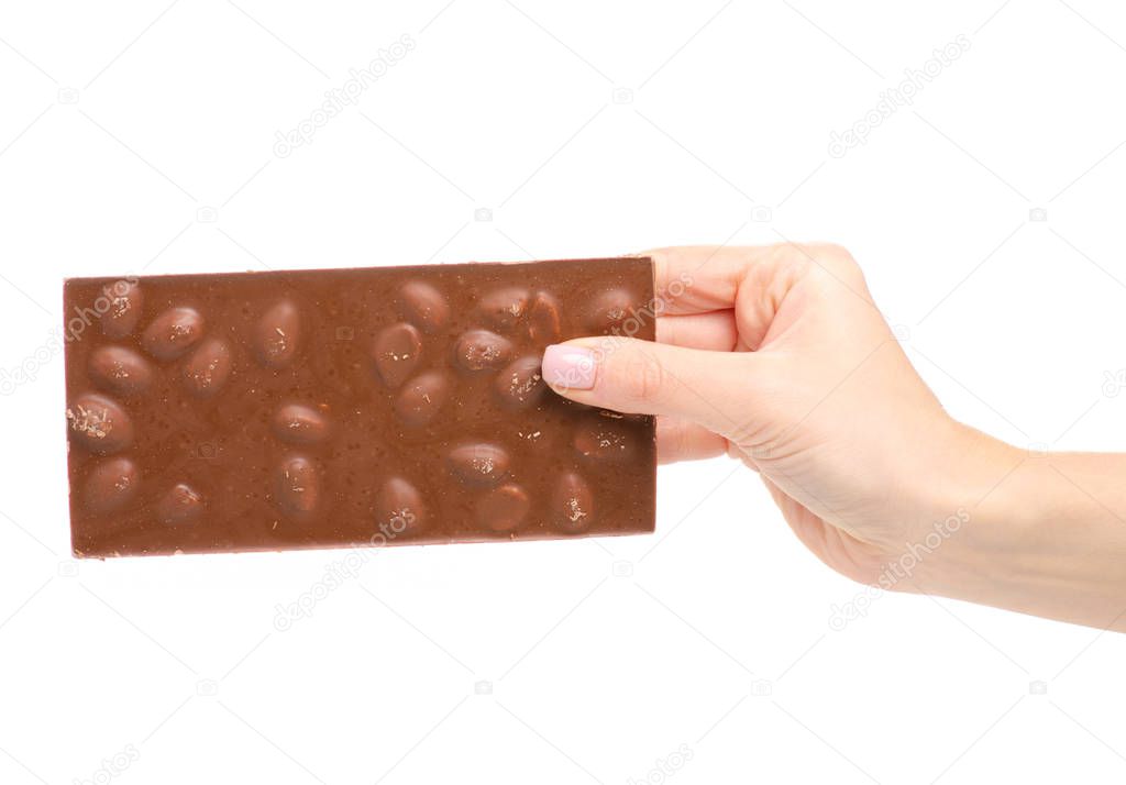 A bar of chocolate with almonds in hand