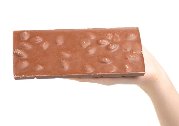 Eine Tafel Schokolade mit Mandeln in der Hand — Stockfoto