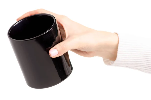 Black cup mug in female hand — Stock Photo, Image