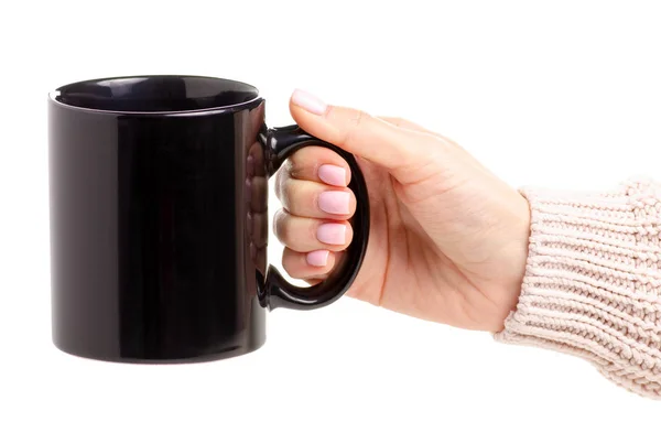 Taza de taza negra en mano femenina —  Fotos de Stock