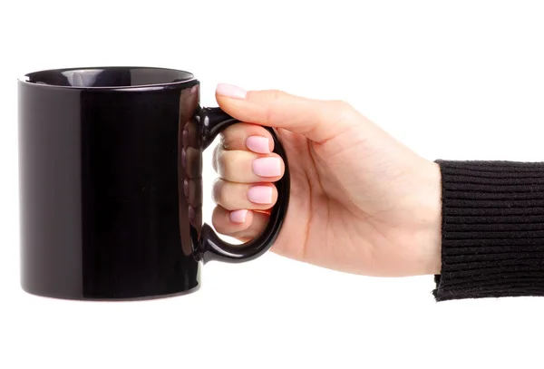 Taza de taza negra en mano femenina —  Fotos de Stock