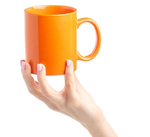 Orange kopp Mugg i kvinnlig hand — Stockfoto