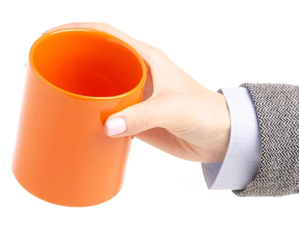 Orange cup mug in female hand — Stock Photo, Image