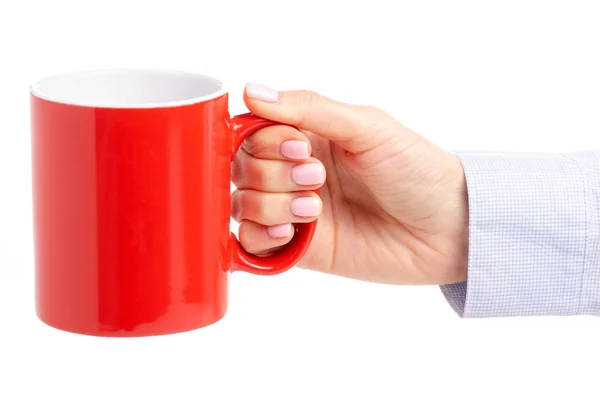A női kéz piros pohár bögre — Stock Fotó