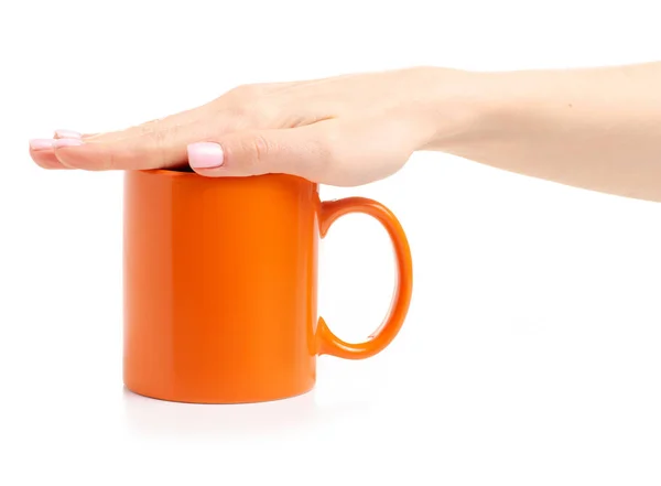 Orange cup mug in female hand — Stock Photo, Image