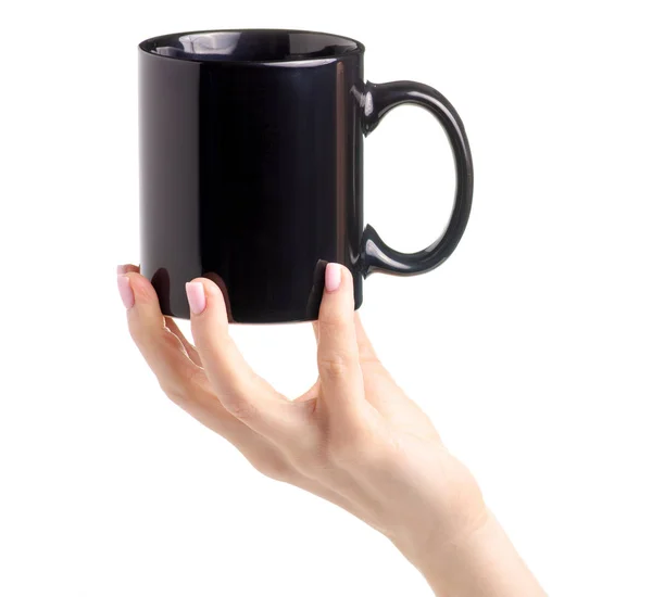 Black cup mug in female hand — Stock Photo, Image