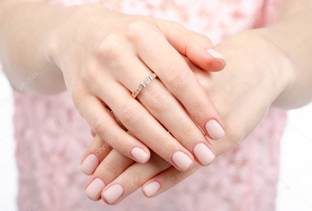 Woman hand a ring of gold beauty