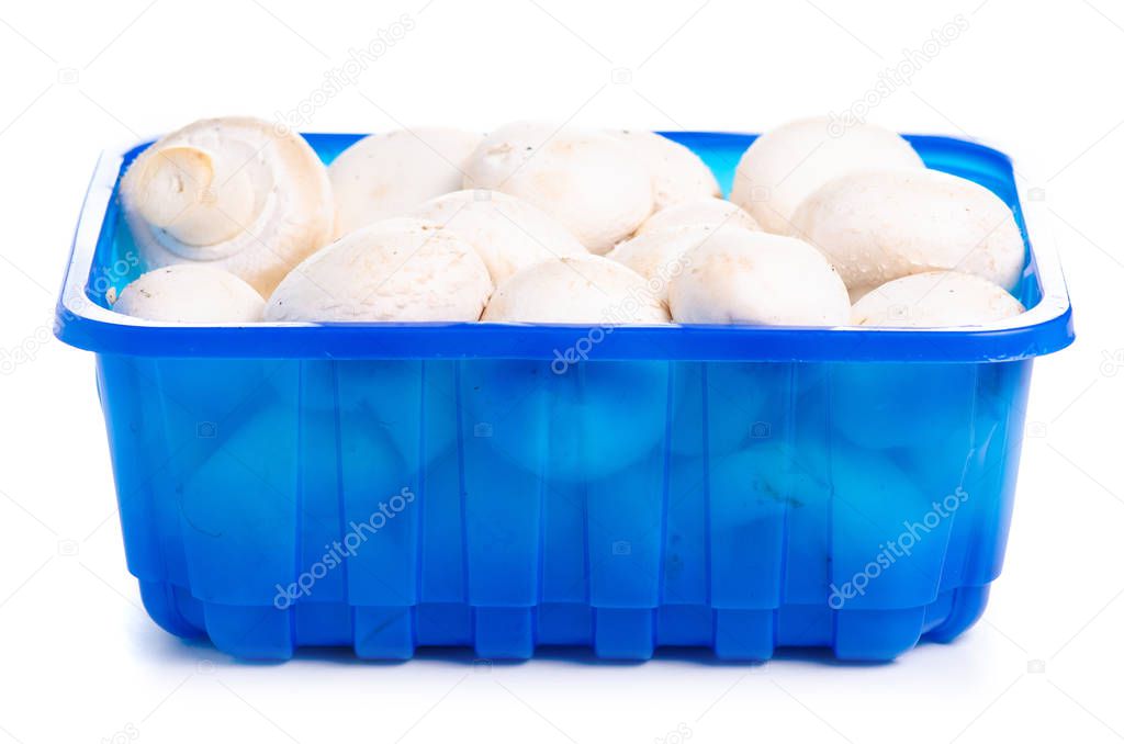 Champignon mushrooms food in plastic container