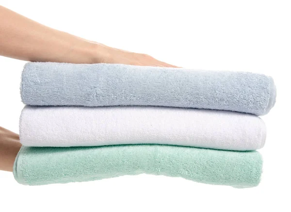 Stack towels whte green blue in hand — Stock Photo, Image