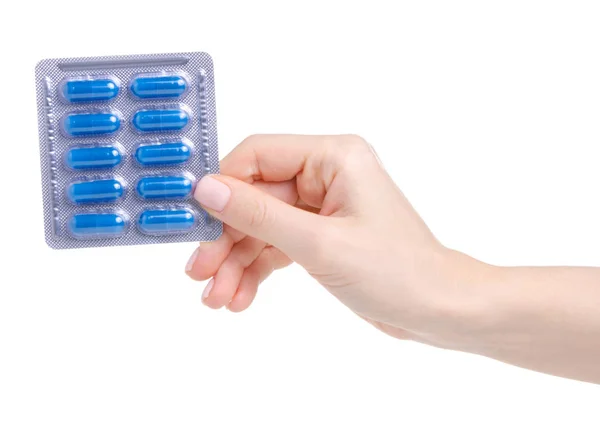 Comprimidos cápsulas azul em blister na saúde medicina mão — Fotografia de Stock