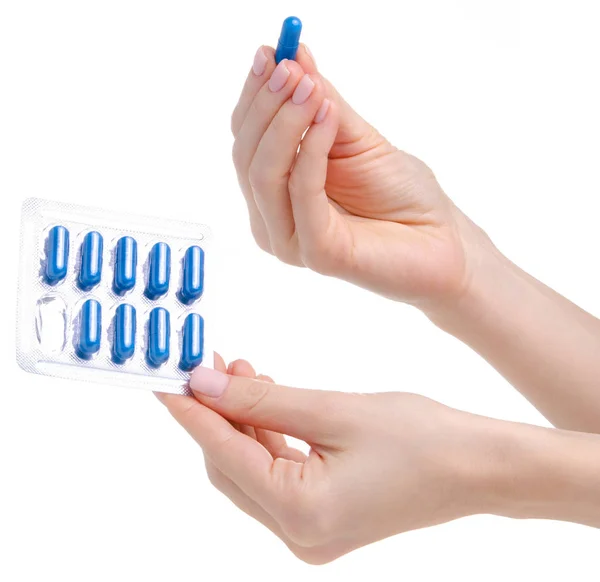 Comprimidos cápsulas azul em blister na saúde medicina mão — Fotografia de Stock