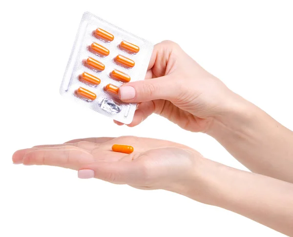 Piller kapsel orange i hand medicin hälsa i blister — Stockfoto