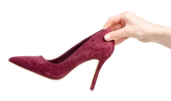 Vrouwelijke rood suede hoge hakken schoenen in de hand — Stockfoto