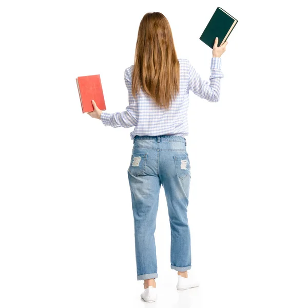 Mulher de jeans azul e camisa com livros nas mãos — Fotografia de Stock