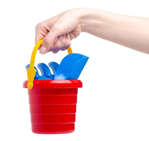 Baby set red sandbox bucket rovel rake toy in hand — стоковое фото