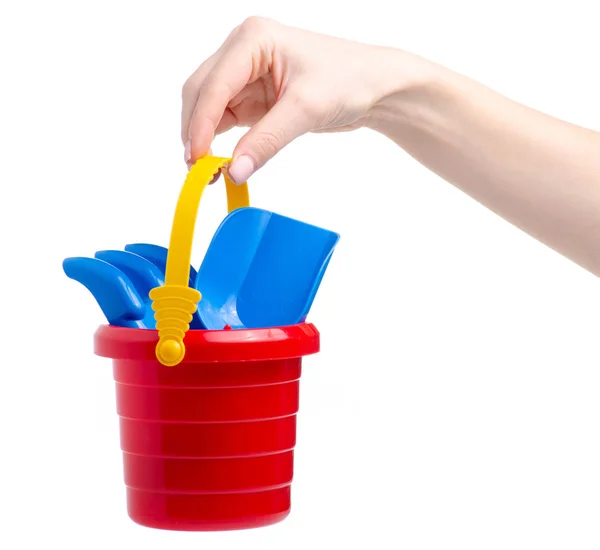 Baby set red sandbox bucket rovel rake toy in hand — стоковое фото