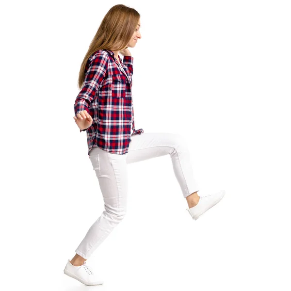 Woman in white jeans and shirt run goes walking — Stock Photo, Image