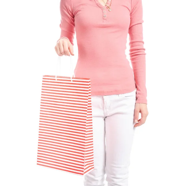 Mulher em jeans brancos e pacote de saco de camisa rosa na mão moda comprar macro venda — Fotografia de Stock