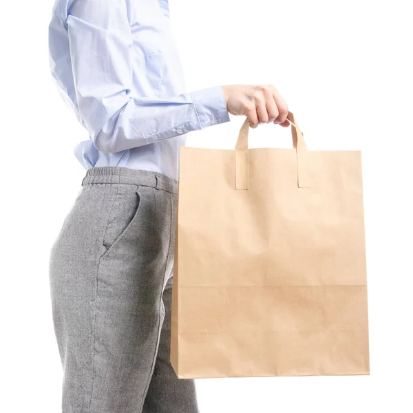 Mujer en pantalones grises y camisa azul bolso paquete en la mano moda comprar venta macro — Foto de Stock