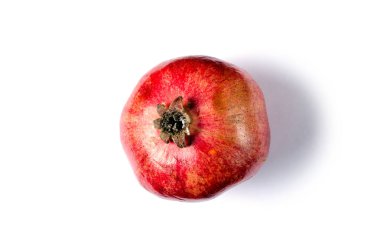 Beyaz zemin üzerine kırmızı nar meyve