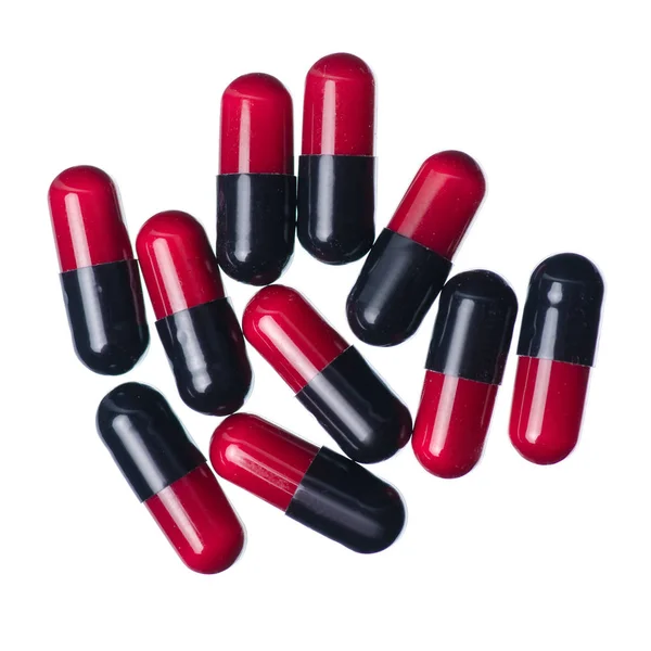 Cápsula pílulas medicina farmácia vermelho preto — Fotografia de Stock