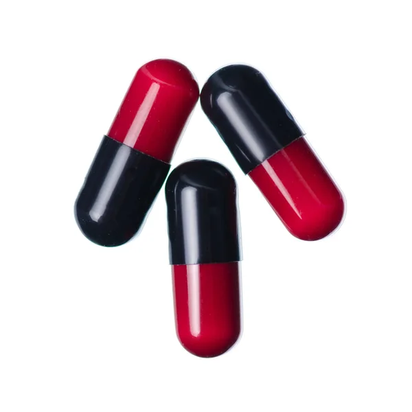 Cápsula pílulas medicina farmácia vermelho preto — Fotografia de Stock