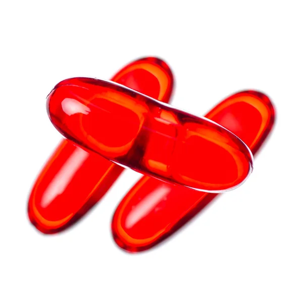 Prášky na kapsle medicína lékárna červený — Stock fotografie