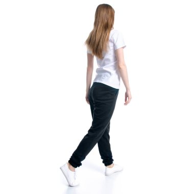 Woman in black sweatpants and white t-shirt walking goes clipart