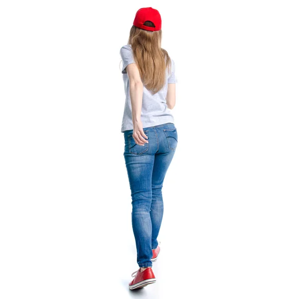 ジーンズ赤キャップ スニーカー行くホワイト バック グラウンドで実行を歩く女性 — ストック写真