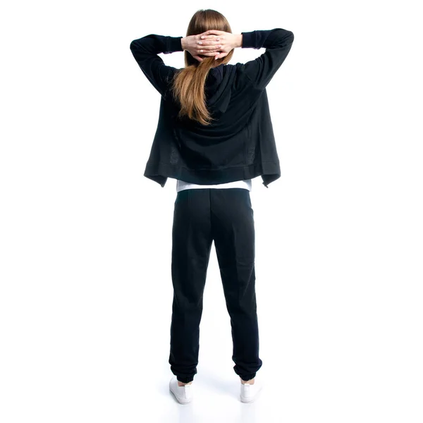 Woman in black tracksuit hood holding head — Stock Photo, Image